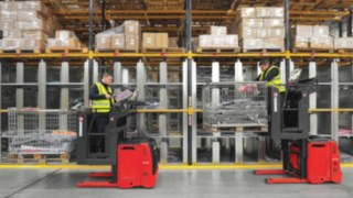 Example image of three Linde high-lift order pickers in a high shelving warehouse.